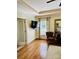 Comfortable bedroom with hardwood floors, neutral paint, and a large window at 107 Cedar Lake Dr, Statesville, NC 28625