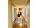 Inviting hallway with hardwood flooring and neutral walls leading to various rooms at 107 Cedar Lake Dr, Statesville, NC 28625