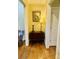 Charming hallway with hardwood floors and accent furniture at 107 Cedar Lake Dr, Statesville, NC 28625