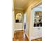 Hallway with hardwood floors, a built-in bookshelf, and plenty of natural light at 107 Cedar Lake Dr, Statesville, NC 28625