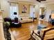 Spacious living room with hardwood floors, fireplace, and large windows with natural light at 107 Cedar Lake Dr, Statesville, NC 28625