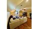 Spacious living room with a plush sectional sofa, hardwood flooring, and modern ceiling fan at 107 Cedar Lake Dr, Statesville, NC 28625