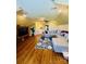 Spacious living room with a plush sectional sofa, hardwood flooring, and modern entertainment center at 107 Cedar Lake Dr, Statesville, NC 28625