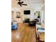 Bright living room featuring custom built-ins, a fireplace, hardwood flooring, and neutral colors at 107 Cedar Lake Dr, Statesville, NC 28625