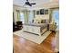 Spacious primary bedroom with a tray ceiling, hardwood floors, and plenty of natural light at 107 Cedar Lake Dr, Statesville, NC 28625