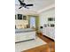 Comfortable primary bedroom with hardwood floors, neutral paint, and an expansive dresser at 107 Cedar Lake Dr, Statesville, NC 28625