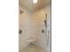 Tiled shower with two shower heads and a built-in corner bench at 107 Cedar Lake Dr, Statesville, NC 28625