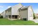 View of the back exterior with siding, a walkout basement, and a two-car garage at 11304 Preservation Ln, Charlotte, NC 28278