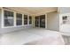 Back patio with concrete floor and multiple windows offers a comfortable outdoor space at 11304 Preservation Ln, Charlotte, NC 28278