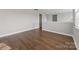 Open bonus room showcasing hardwood floors and a neutral color scheme with ample natural light at 11304 Preservation Ln, Charlotte, NC 28278