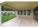 Large covered patio with recessed lighting and a view of a wooded backyard at 11304 Preservation Ln, Charlotte, NC 28278