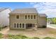 This two-story home has a covered back patio as well as a spacious backyard with sod at 11304 Preservation Ln, Charlotte, NC 28278