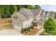 A beautifully designed two-story home with a two-car garage and an attractive, landscaped front yard at 11304 Preservation Ln, Charlotte, NC 28278