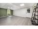 Basement room boasts a window and a convenient door for easy access, blending indoor/outdoor living seamlessly at 120 N Cardinal N Dr, New London, NC 28127