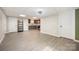 Spacious room with a modern kitchenette, durable floors, and easy access to the outdoors creates a flexible living space at 120 N Cardinal N Dr, New London, NC 28127