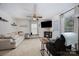 The light and airy living room features a ceiling fan and cozy seating at 120 N Cardinal N Dr, New London, NC 28127