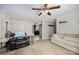 The spacious living room features a ceiling fan and a view of the kitchen at 120 N Cardinal N Dr, New London, NC 28127
