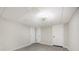 An expansive room showcases neutral walls, modern lighting, and grey wood floors, offering versatile living space at 120 N Cardinal N Dr, New London, NC 28127