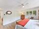 Cozy bedroom with ample natural light, complemented by wood flooring and neutral wall tones at 1278 Island Creek Dr, Troy, NC 27371