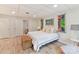 Bright bedroom with wood floors, light walls, and comfy bed with wooden chest at 1278 Island Creek Dr, Troy, NC 27371
