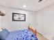 Small bedroom with wood flooring, white walls, and blue and white comforter at 1278 Island Creek Dr, Troy, NC 27371