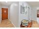 Inviting entryway featuring a wooden door, wood flooring, and tasteful decor at 1278 Island Creek Dr, Troy, NC 27371
