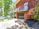 Charming home with a garage and a balcony overlooking the lake, complemented by beautiful landscaping at 1278 Island Creek Dr, Troy, NC 27371