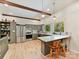 Modern kitchen featuring stainless steel appliances, an island with stools, and ample natural light at 1278 Island Creek Dr, Troy, NC 27371