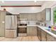 Well-lit kitchen with stainless steel appliances, ample counter space, and white subway tile backsplash at 1278 Island Creek Dr, Troy, NC 27371