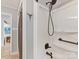 Shower featuring bronze fixtures, white shower stall, and a view into a dining area at 1278 Island Creek Dr, Troy, NC 27371