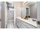 Bathroom with white cabinets, double vanity, and walk-in shower at 129 Morrison Cove Rd, Mooresville, NC 28117