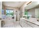 Bathroom with double sinks, large window, tub, and separate shower at 129 Morrison Cove Rd, Mooresville, NC 28117
