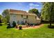 Expansive view of the home's backyard, deck and fire pit at 129 Morrison Cove Rd, Mooresville, NC 28117