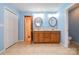 A full bathroom featuring a double vanity, twin mirrors, and recessed lighting at 1376 Garland Ln, Lincolnton, NC 28092