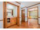 Entryway with wood flooring, a mirrored vanity, and access to other rooms in the home at 1376 Garland Ln, Lincolnton, NC 28092