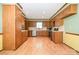 Spacious kitchen featuring wood cabinets, stainless steel appliances, and light-colored flooring at 1376 Garland Ln, Lincolnton, NC 28092