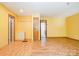 Open living room featuring hardwood floors, bright wall paint, and multiple entryways at 1376 Garland Ln, Lincolnton, NC 28092
