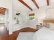 This bedroom features built-in shelving and warm hardwood floors at 1438 Larkfield Ln, Charlotte, NC 28210