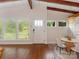 Bright dining room featuring hardwood floors, vaulted ceilings, and multiple windows at 1438 Larkfield Ln, Charlotte, NC 28210