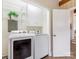 A laundry area features white front load washer and dryer set at 1438 Larkfield Ln, Charlotte, NC 28210