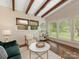 Cozy living room with hardwood floors, exposed beams, and ample natural light at 1438 Larkfield Ln, Charlotte, NC 28210
