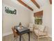 Bright home office with natural light, desk, and two comfortable armchairs at 1438 Larkfield Ln, Charlotte, NC 28210