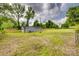 A vast yard enclosed by classic and wood fences, dotted with trees, under a partly cloudy sky at 1495 Memorial Park Rd # 10, Lancaster, SC 29720