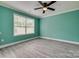 Bedroom featuring stylish gray laminate flooring and a modern ceiling fan at 1495 Memorial Park Rd # 10, Lancaster, SC 29720