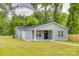 Charming single-story home featuring a well-maintained lawn, covered porch, and light gray siding at 1495 Memorial Park Rd # 10, Lancaster, SC 29720