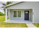 A cozy front porch with a black front door featuring a decorative glass insert and a window on the side at 1495 Memorial Park Rd # 10, Lancaster, SC 29720