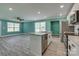 An open kitchen featuring an island with a sink, stainless steel appliances and vinyl floors at 1495 Memorial Park Rd # 10, Lancaster, SC 29720