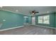 Open living room and dining area with modern flooring, ceiling fan, recessed lighting, and large windows at 1495 Memorial Park Rd # 10, Lancaster, SC 29720