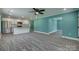 Open concept living space with a kitchen island, stainless steel appliances, and sleek vinyl floors at 1495 Memorial Park Rd # 10, Lancaster, SC 29720