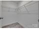 Practical walk-in closet with wire shelving and durable flooring for organizing clothes and accessories at 1495 Memorial Park Rd # 10, Lancaster, SC 29720
